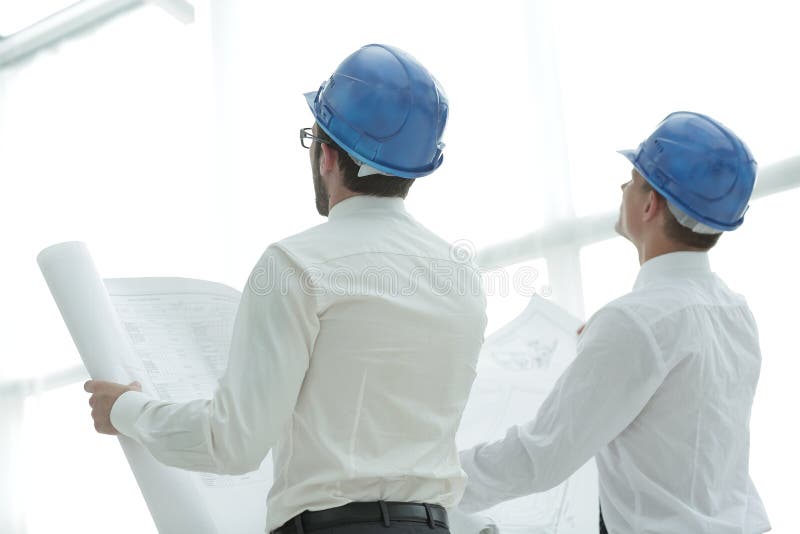 Rear view. architect and Builder looking at blank screen stock images