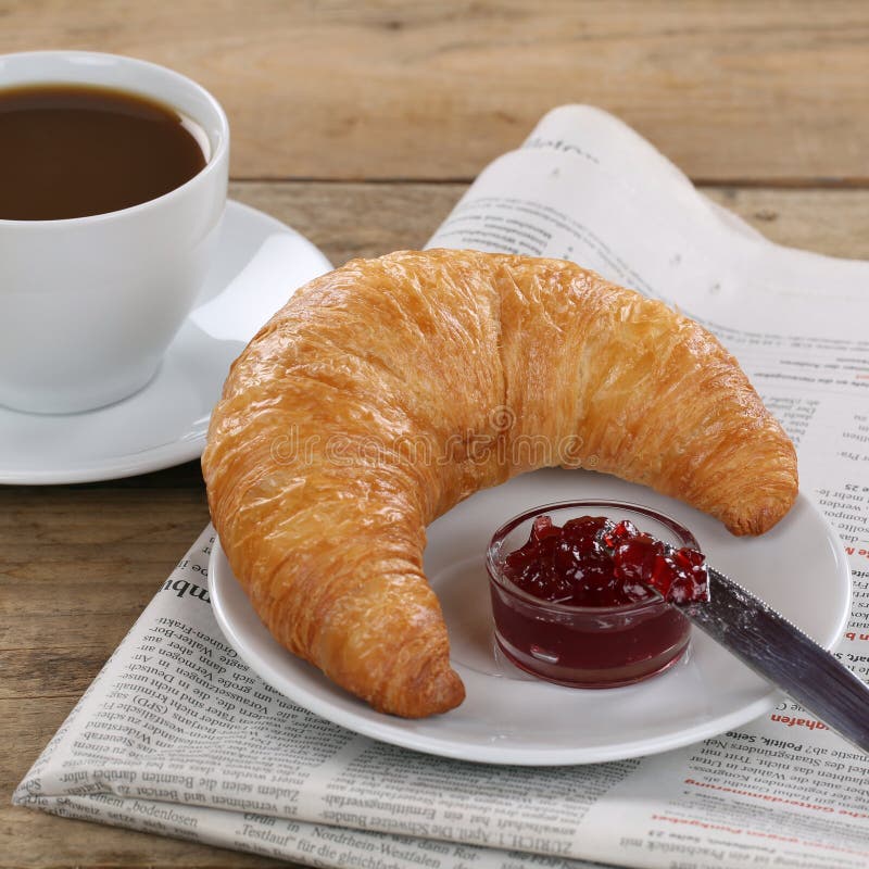 Business Breakfast with Croissant, Coffee and Newspaper Stock Image