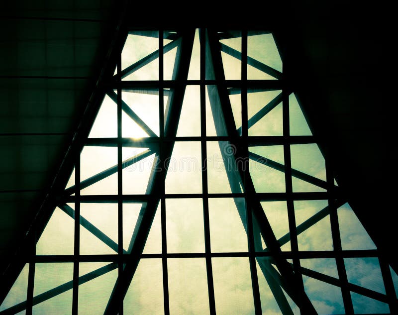 Business building interior, sunburst over building roof,structure pattern.