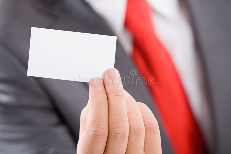 Close-up of male hand holding a business card. Male hand holding businessman stock images, royalty-free photos and pictures