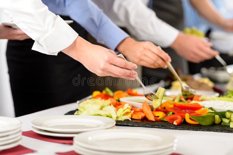 Business catering people take buffet food during company event