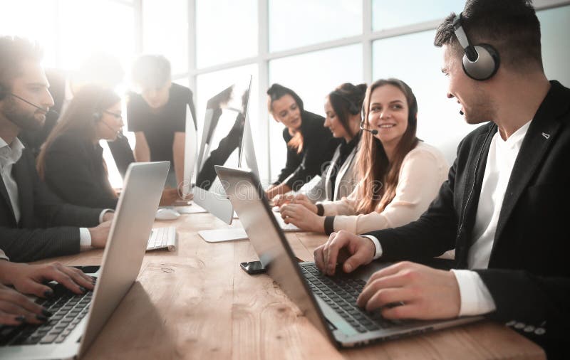 Business center employees using computers in the workplace stock image Business center employees using computers in the workplace stock image