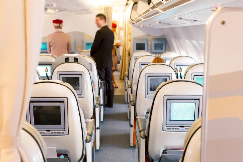 Business class seats in airplane stock photos