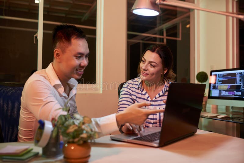 Business colleagues using laptop and working in team royalty free stock images