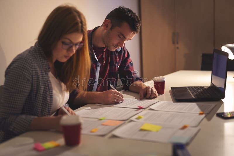 Business colleagues working overtime on a project royalty free stock photo