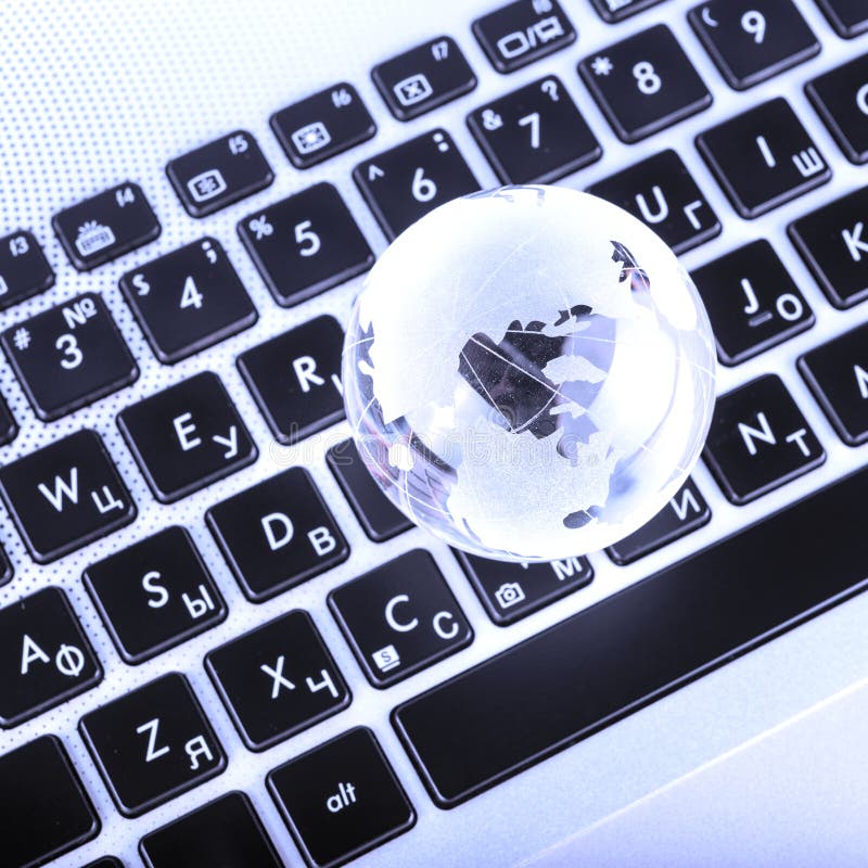 business concept of glass globe on a laptop keyboard