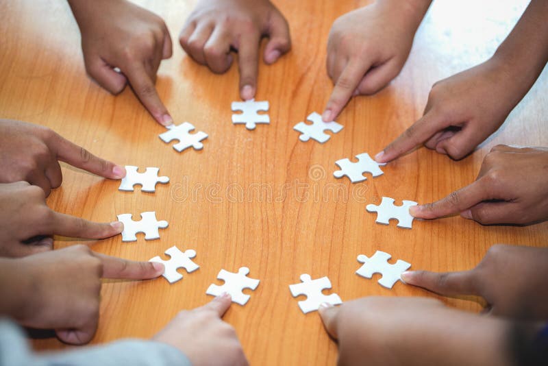 Business concept, Group of business people assembling jigsaw puzzle and represent team support and help togethe royalty free stock photos Business concept, Group of business people assembling jigsaw puzzle and represent team support and help togethe royalty free stock photos