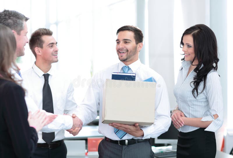 Business concept - handsome happy business man in office.