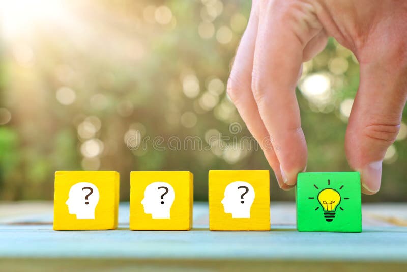 Business Concept image of revealing an idea, finding the right solution during creative process. Hand picking cube with bright royalty free stock images Business Concept image of revealing an idea, finding the right solution during creative process. Hand picking cube with bright royalty free stock images