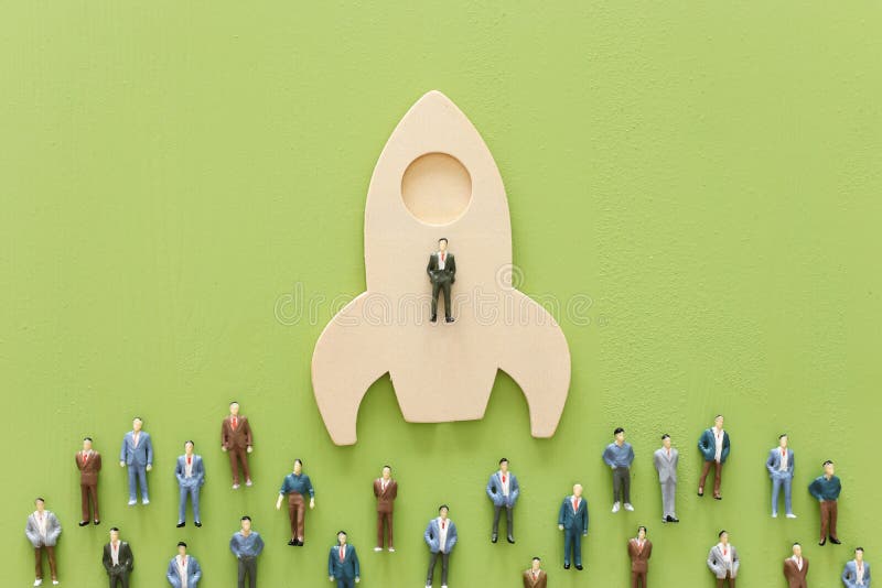 Business concept of leadership and teamwork. A group of people on a rocket gain an advantage over the others royalty free stock photos