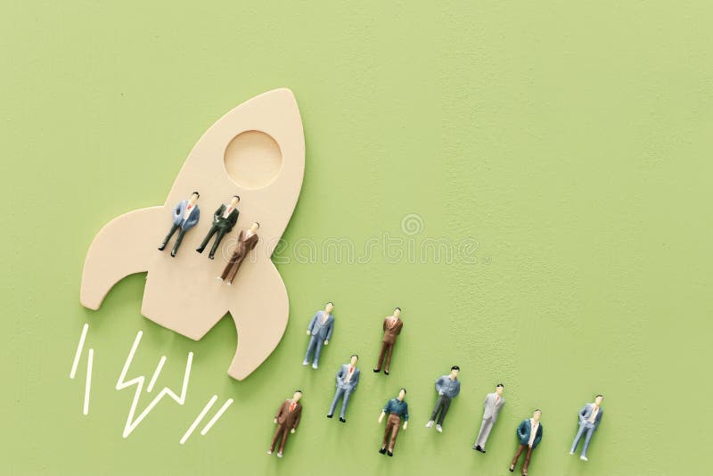 Business concept of leadership and teamwork. A group of people on a rocket gain an advantage over the others stock photos