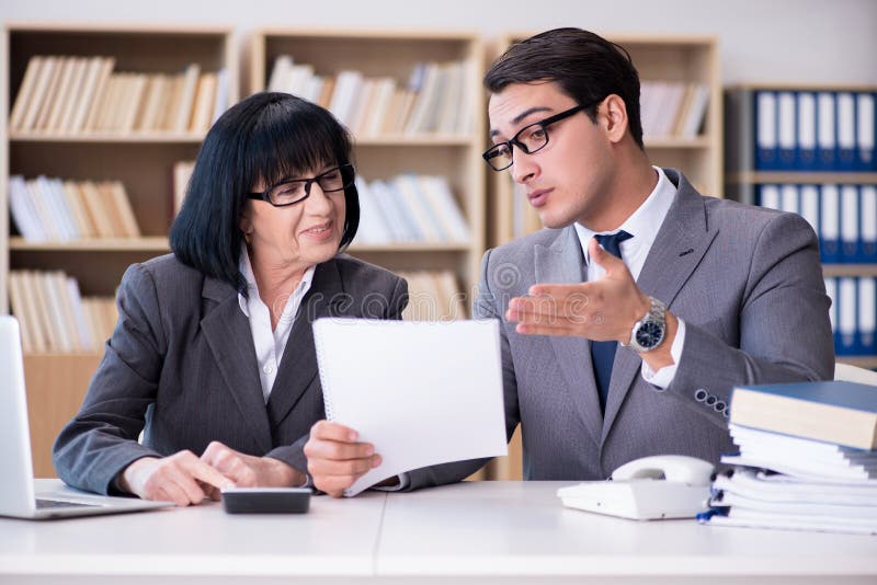 The Business Couple Having Discussion In The Office Stock Photo - Image