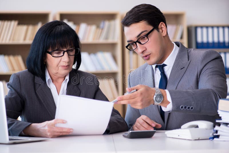 The Business Couple Having Discussion in the Office Stock Photo Image