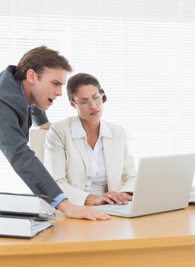 Business Couple Using Laptop at Office Desk Stock Photo Image of