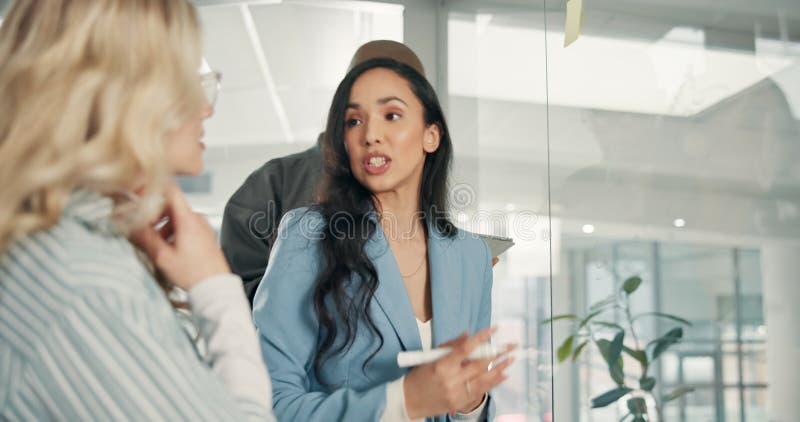 Business, discussion and people writing on glass wall for story development, publication layout or creative project stock video footage