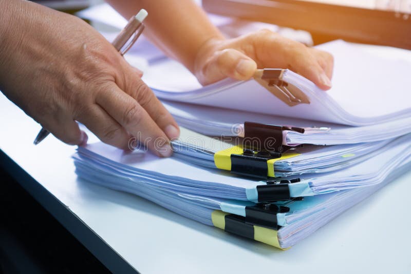 Business Documents Concept Businessman Hands Working in Stacks Paper