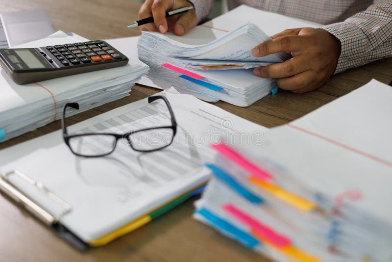 Business Documents concept document achieves on folders papers at busy work desk office royalty free stock photo.