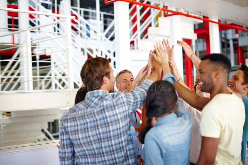 Business, employees and happy with high five at office for team building, collaboration and support for project. People stock photo