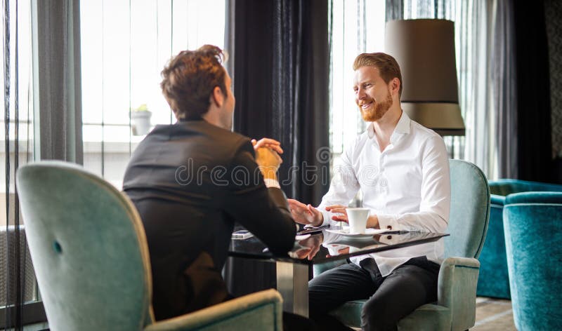 Business executive men, colleagues discussing work at meeting during coffee break. royalty free stock photos