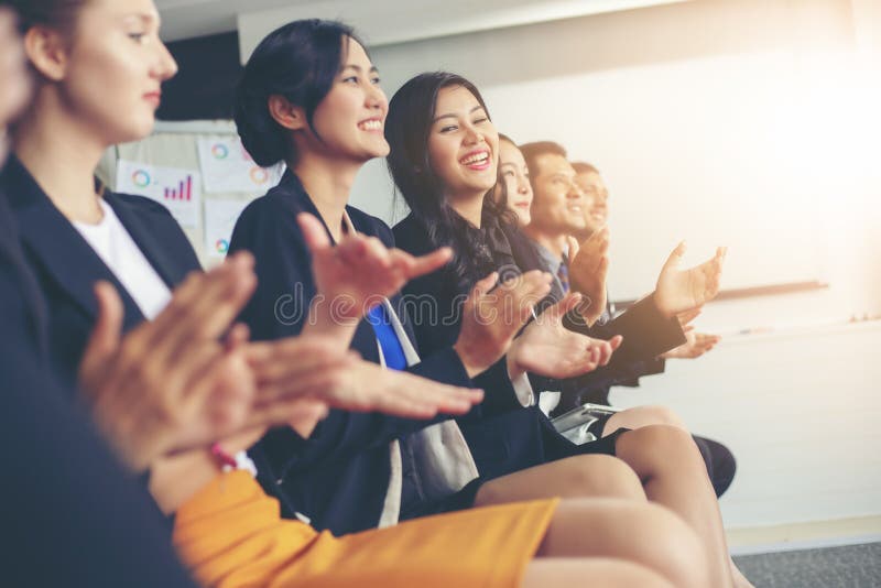 Business executives applauding in a business meeting stock photo Business executives applauding in a business meeting stock photo