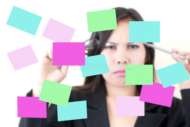 Business female thinking with sticky note. royalty free stock photos