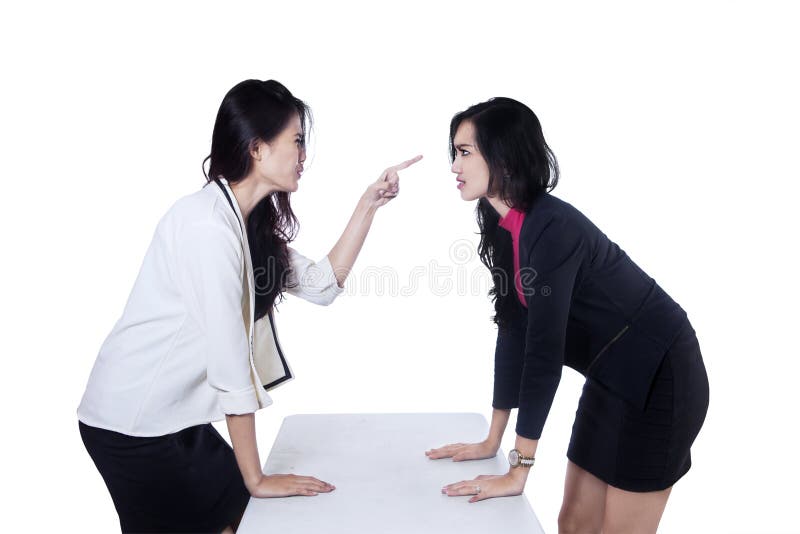 Two businesswoman arguing on white background. Two businesswoman arguing on white background