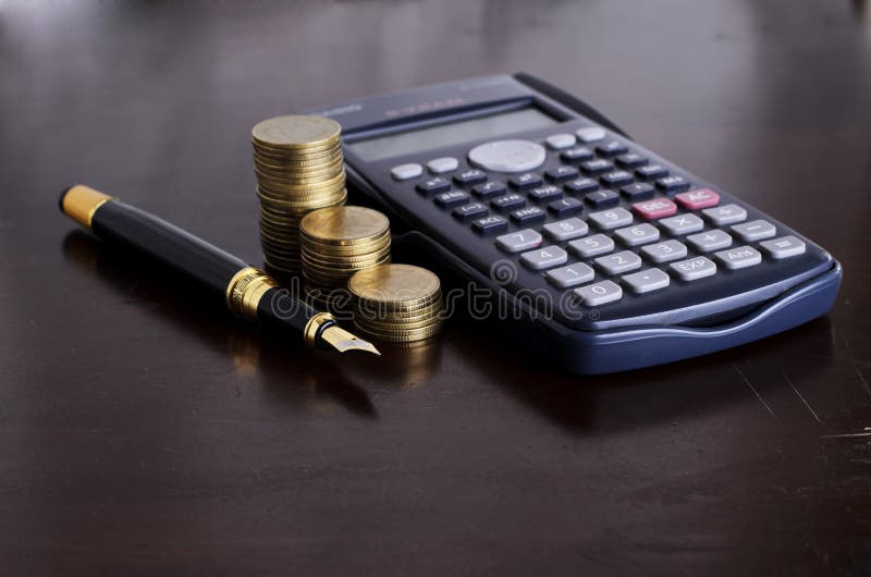 Business and Finance concept with Fountain pen and Calculator mo