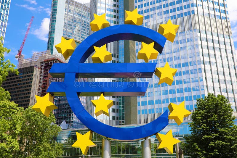 Business and finance concept with giant Euro sign at European Central Bank headquarters in the morning, business district in stock image Business and finance concept with giant Euro sign at European Central Bank headquarters in the morning, business district in stock image