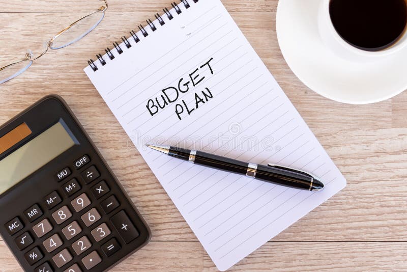 Business plan text on note pad royalty free stock photo