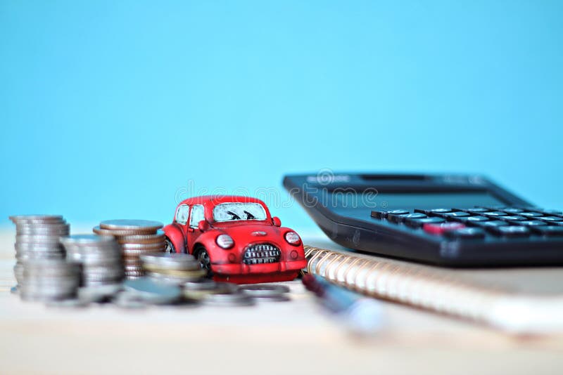 Miniature Car Model Coins Stack Calculator And Notebook Paper On