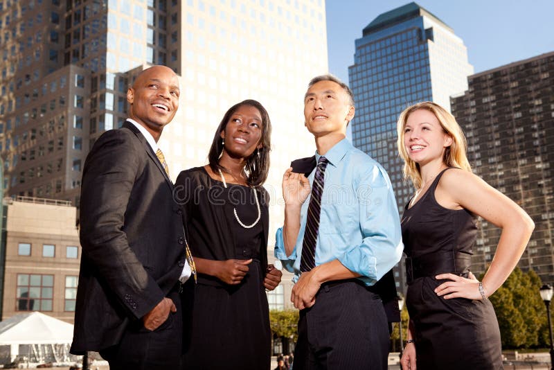 A group of business people looking out of the frame - future concept. A group of business people looking out of the frame - future concept