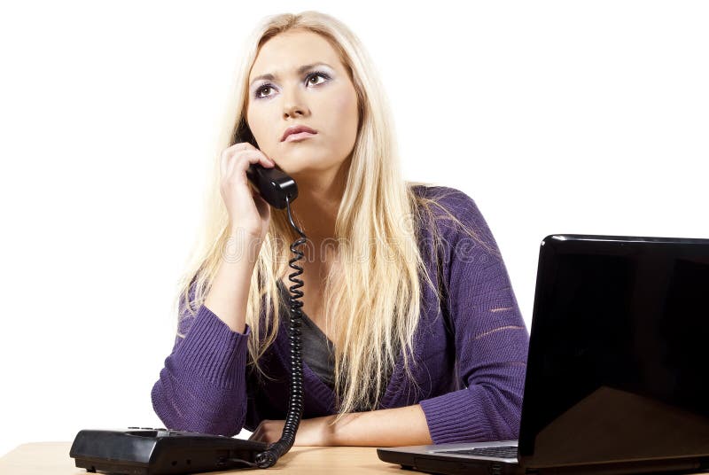 Business girl with laptop sitting at the table