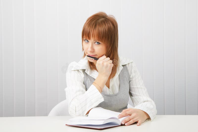 Business girl with notebook and pen