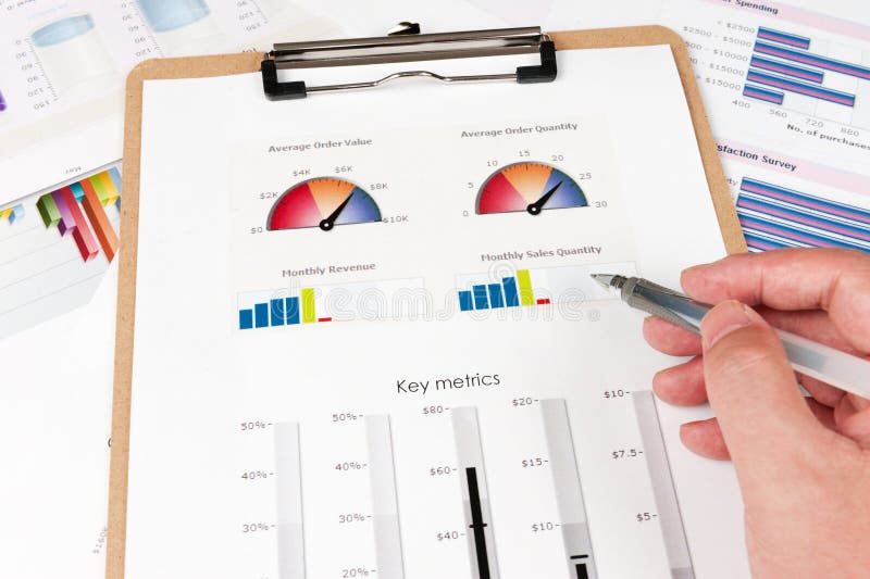 Business graph printed on the white paper with a hand holding a pen on it. Diagram marketing research concept stock images, royalty-free photos and pictures