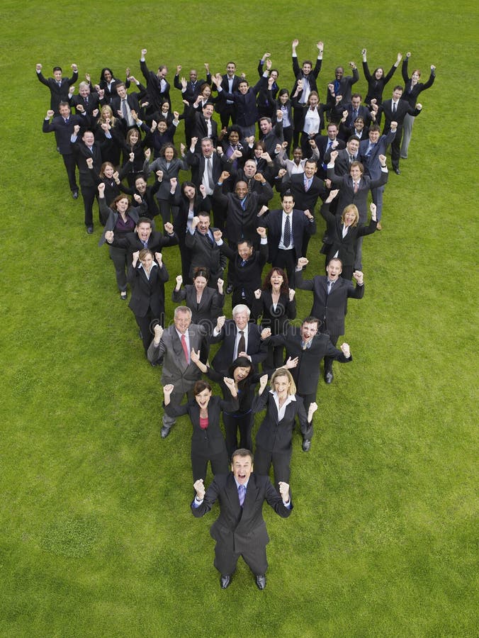 Elevated view of large group of business people cheering in triangle formation. Elevated view of large group of business people cheering in triangle formation