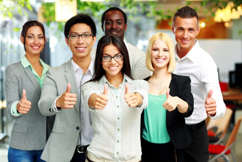 Business group giving thumbs up stock image