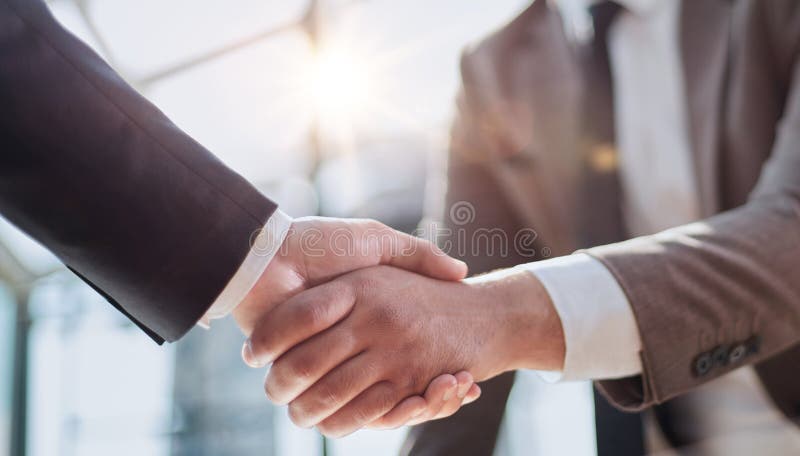 Closeup of handshake of business partners royalty free stock photo