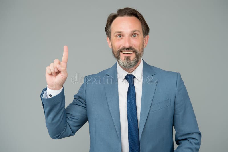 Business idea inspiration. Businessman point finger up grey background. Bearded man got idea. Marketing idea and royalty free stock photo Business idea inspiration. Businessman point finger up grey background. Bearded man got idea. Marketing idea and royalty free stock photo