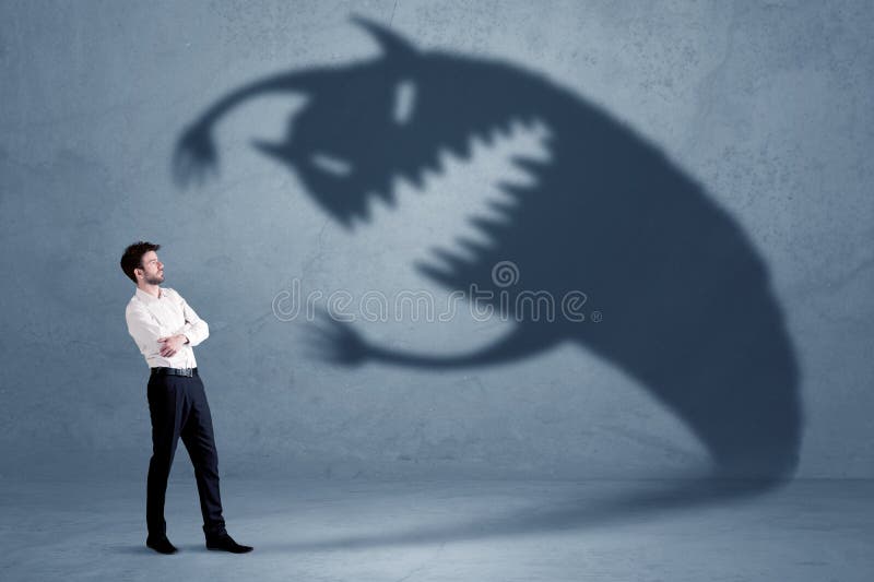 Business man afraid of his own shadow monster concept royalty free stock image Business man afraid of his own shadow monster concept royalty free stock image