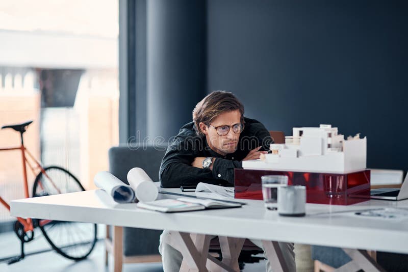 Business, man and architecture with model, engineering design and thinking with construction company. Person, employee stock photography