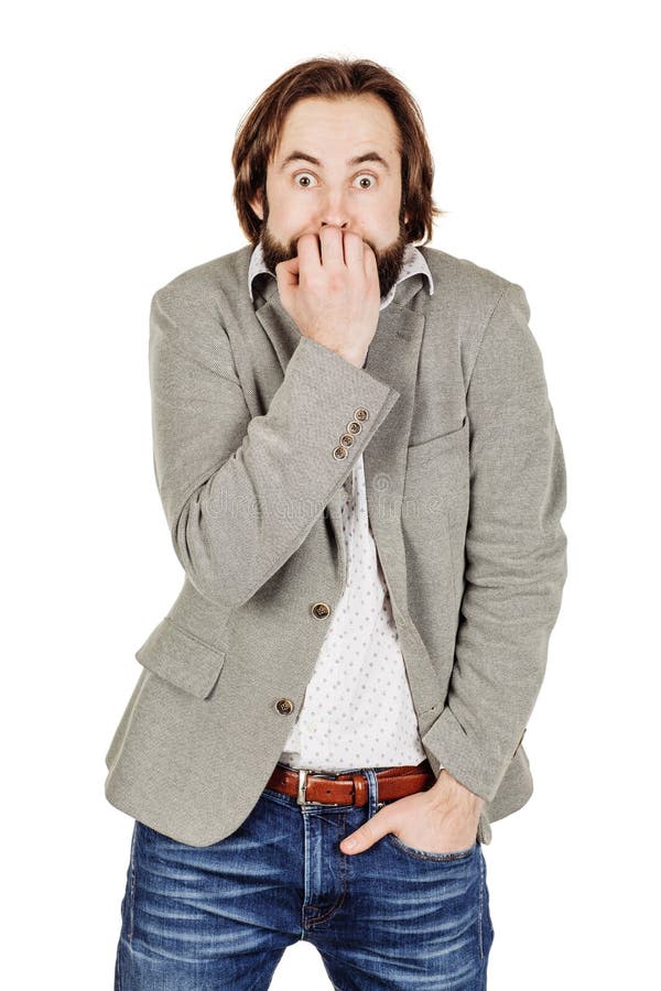 business man biting his nails fingers freaking out. human emotion expression and lifestyle concept. image on a white studio stock photography business man biting his nails fingers freaking out. human emotion expression and lifestyle concept. image on a white studio stock photography