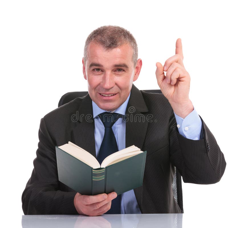 business-man-book-points-up-reading-his-office-pointing-looking-camera-white-background-34596923.jpg