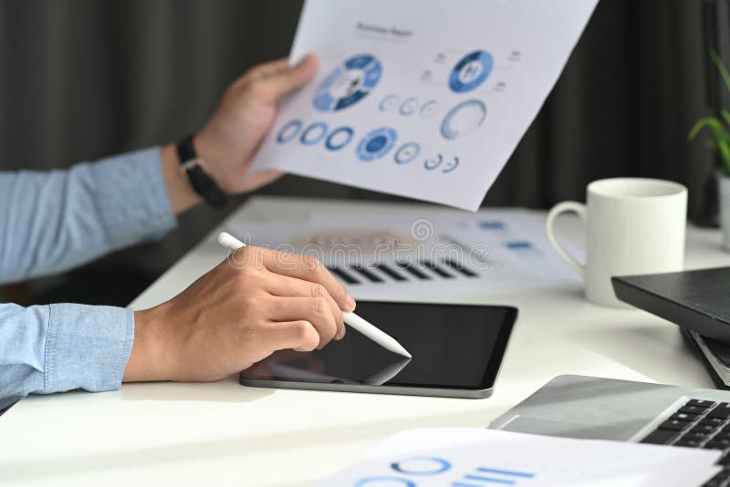A business man developing a business project and analyzing market data information on a modern digital tablet computer. royalty free stock photography