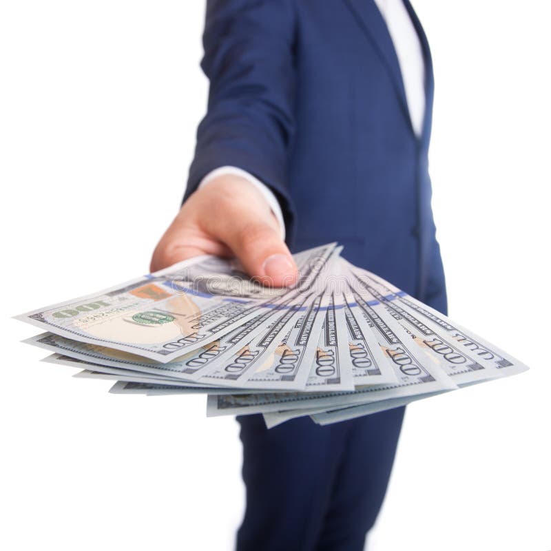 The Spread Of Dollar Paper Currency In The Hand On City Background