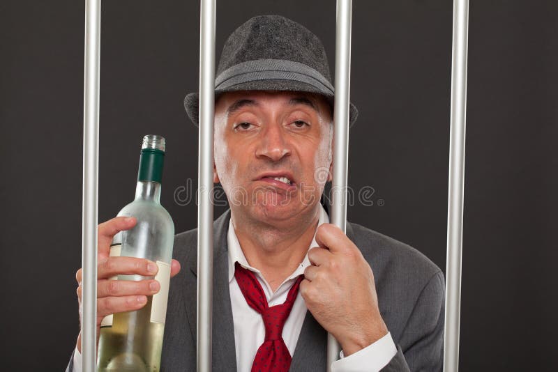 Business man drunk in jail stock image. Image of beverage 63480597