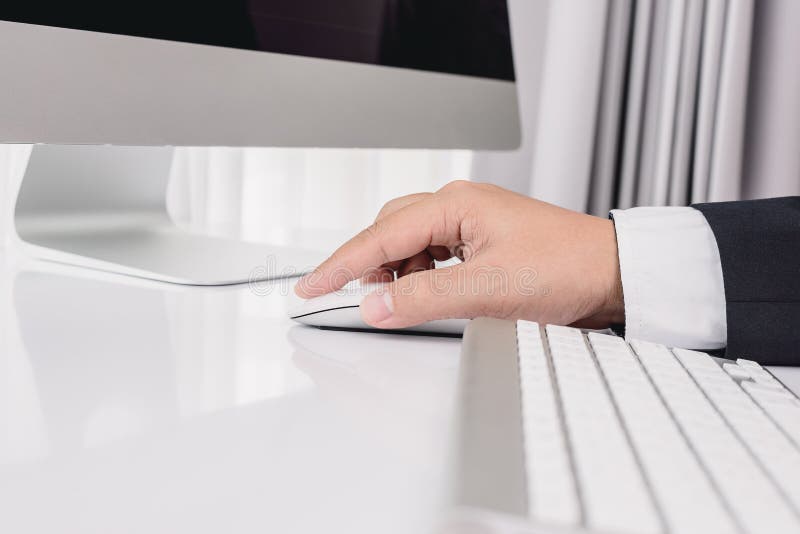Business man hand using computer mouse royalty free stock image