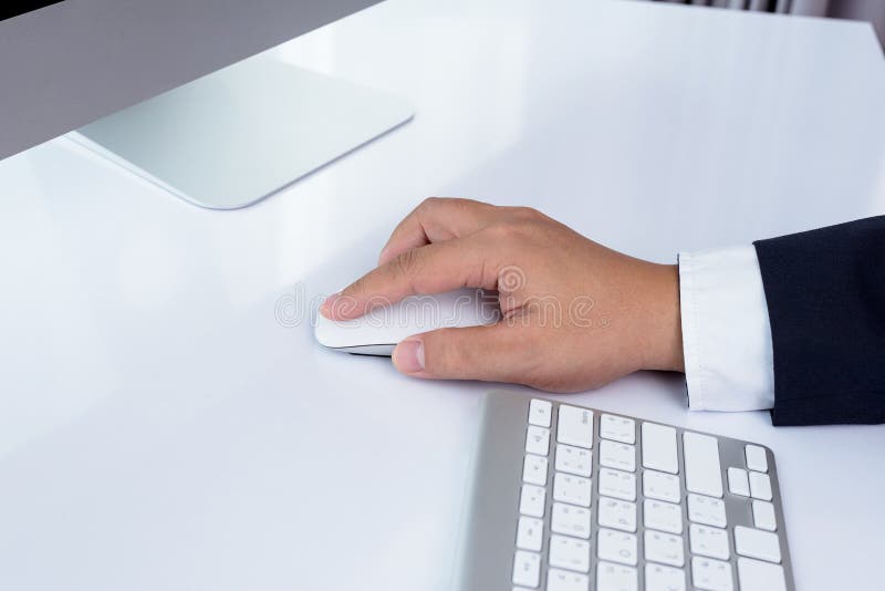 Business man hand using computer mouse stock image