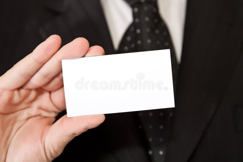 Business man holding blank businesscard