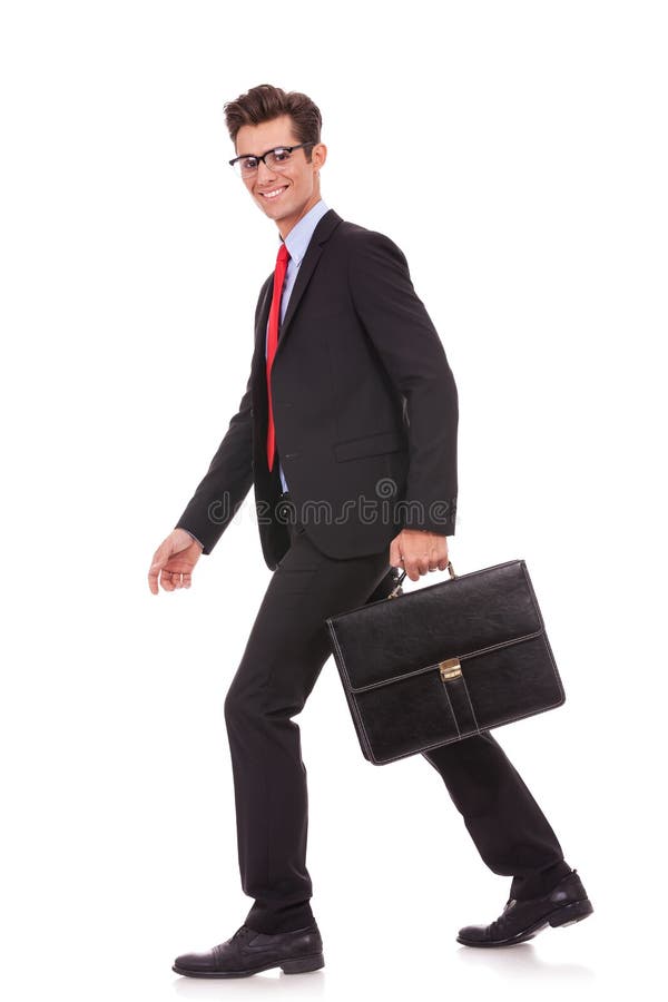 Business Man Holding A Briefcase And Walking Royalty Free Stock Images