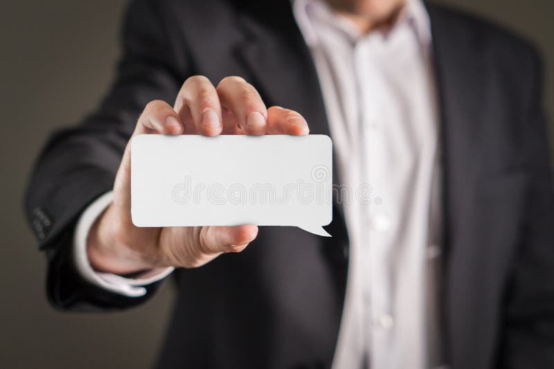 Business man holding business card. stock images